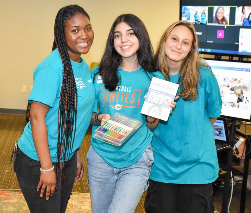 Three NVEEE interns at an event