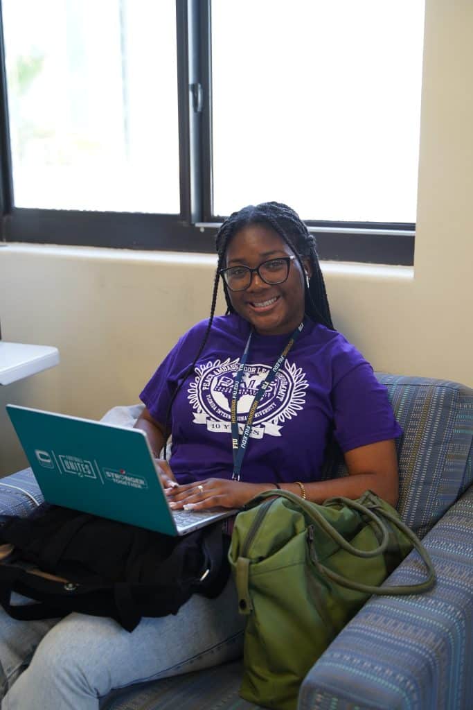 An intern working on a laptop at PALS