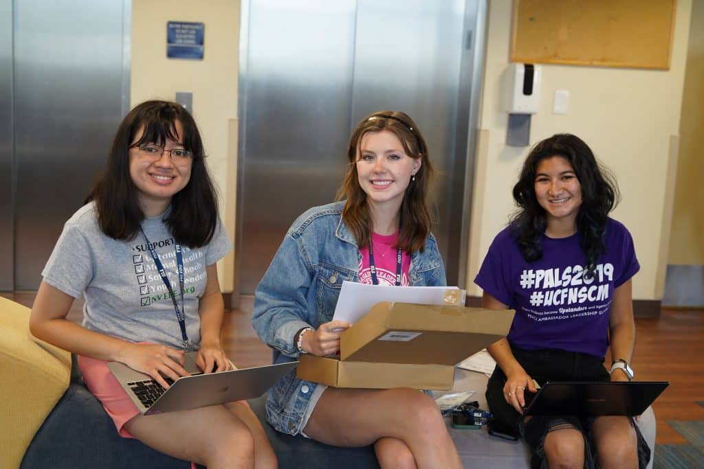 Interns preparing materials together at PALS