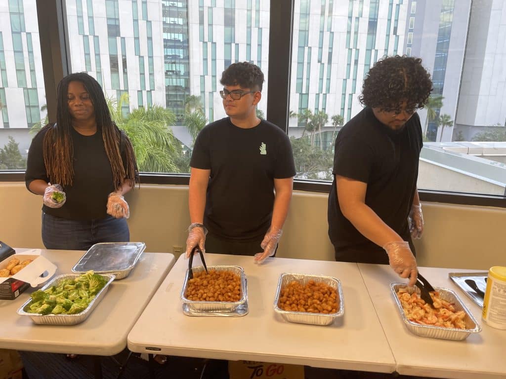 NVEEE interns serving a meal at PALS