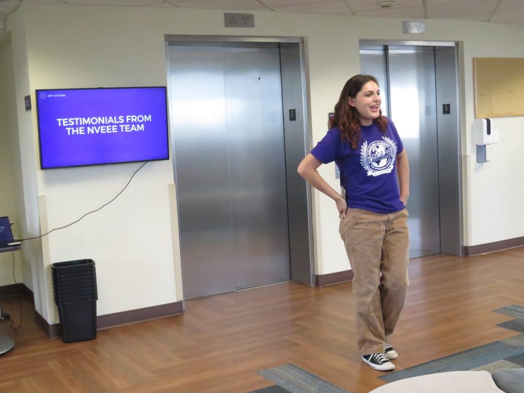 An intern leading a session on team testimonials