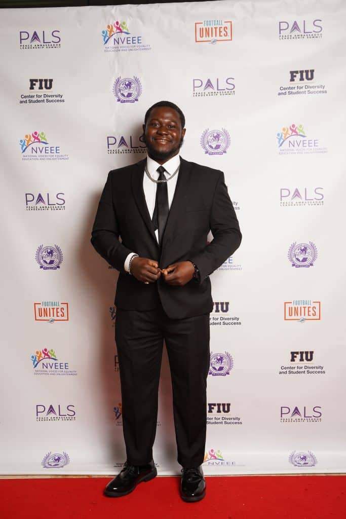 An intern in a suit at the PALS banquet