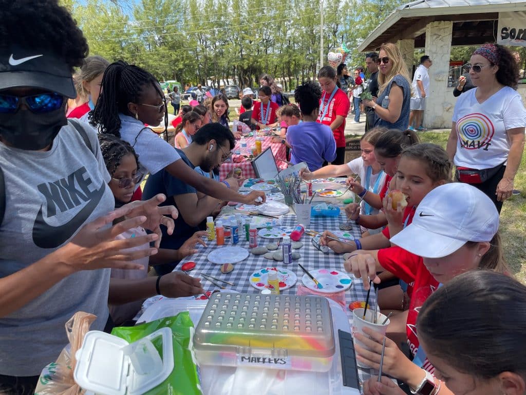 PALP students leading a hands-on activity at a community event
