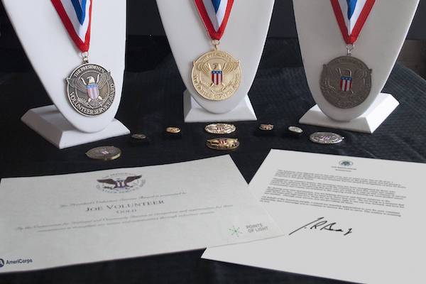 President’s Volunteer Service Award medals and certificates prepared for NVEEE interns