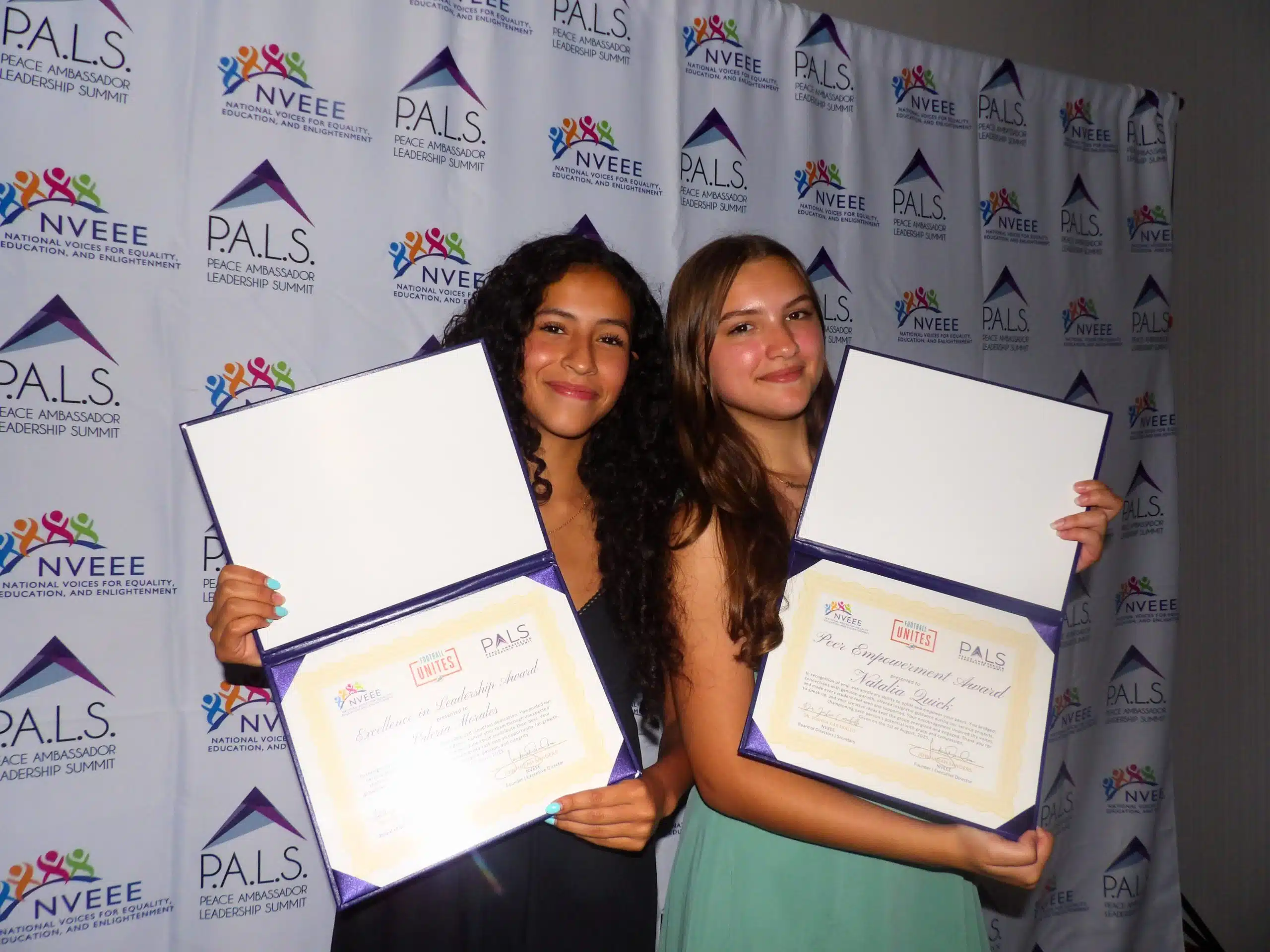 PALS students holding their certificates at an NVEEE recognition ceremony