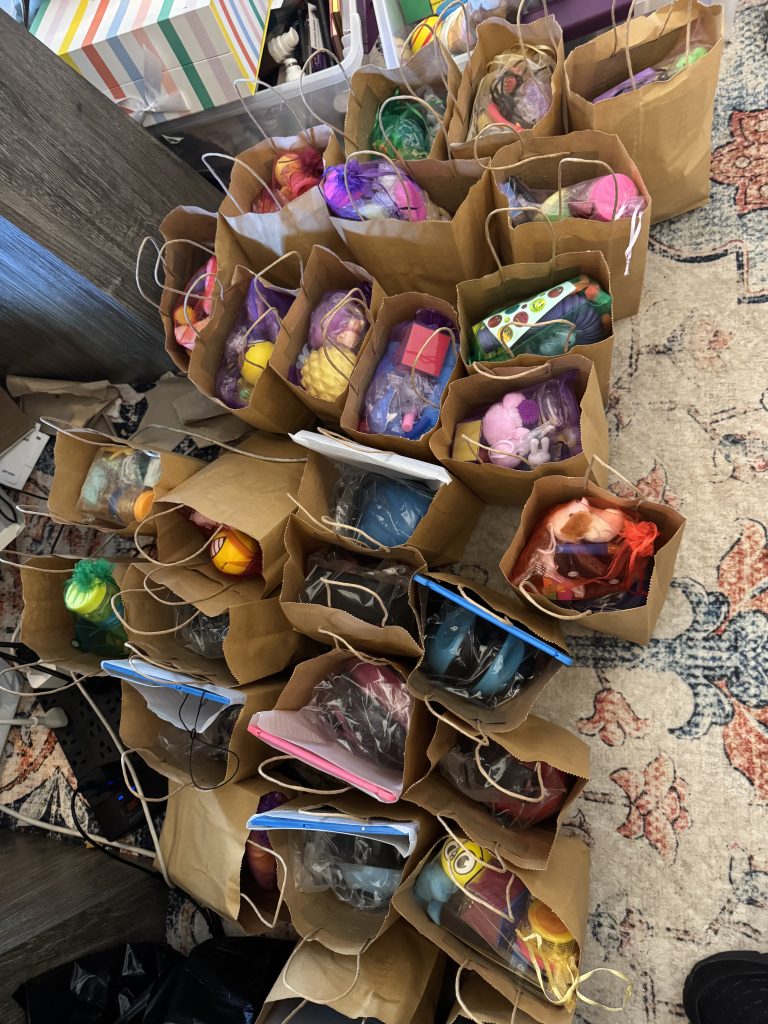 Rows of gift bags filled with supplies for elementary school students with autism