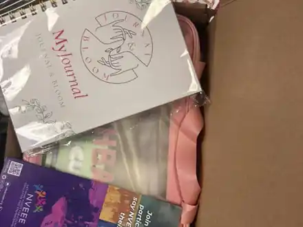 A gift box with a journal, pouch and NVEEE booklet